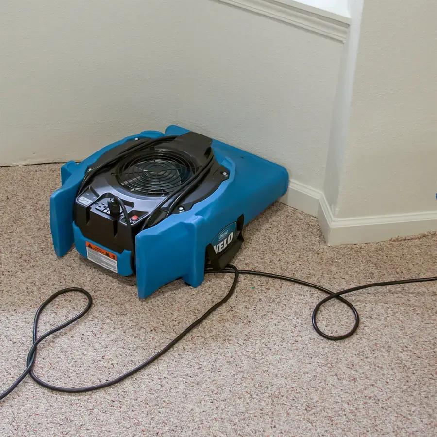 Air movers drying a great room after a storm leak in Agoura Hills