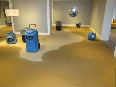 A dehumidifier and air mover drying an Agoura Hills home